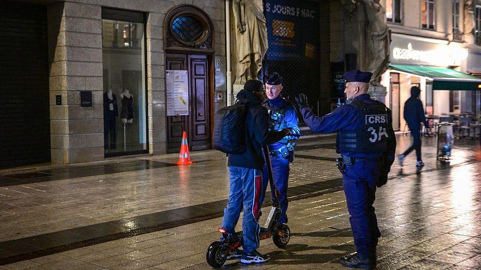French police officer during curfew in Lyon