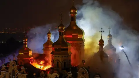 Russian Strikes Kill Nine and Burn Historic Kyiv Cathedral