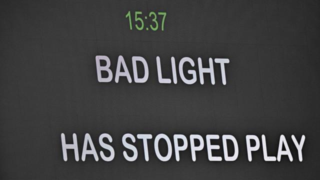 Bad light stops play