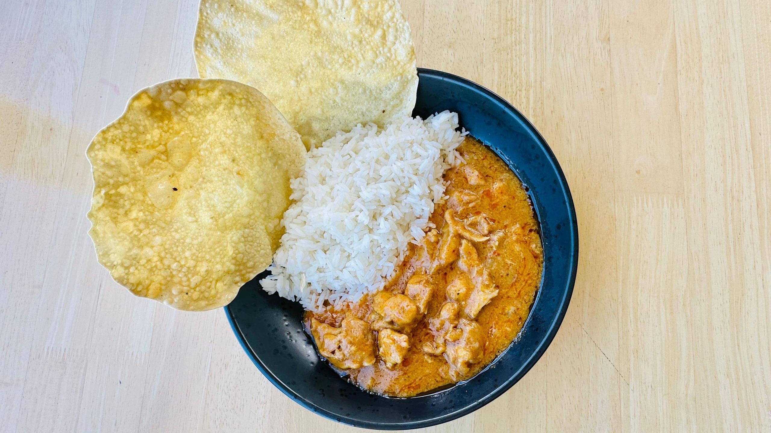 Curry dish with green flakes