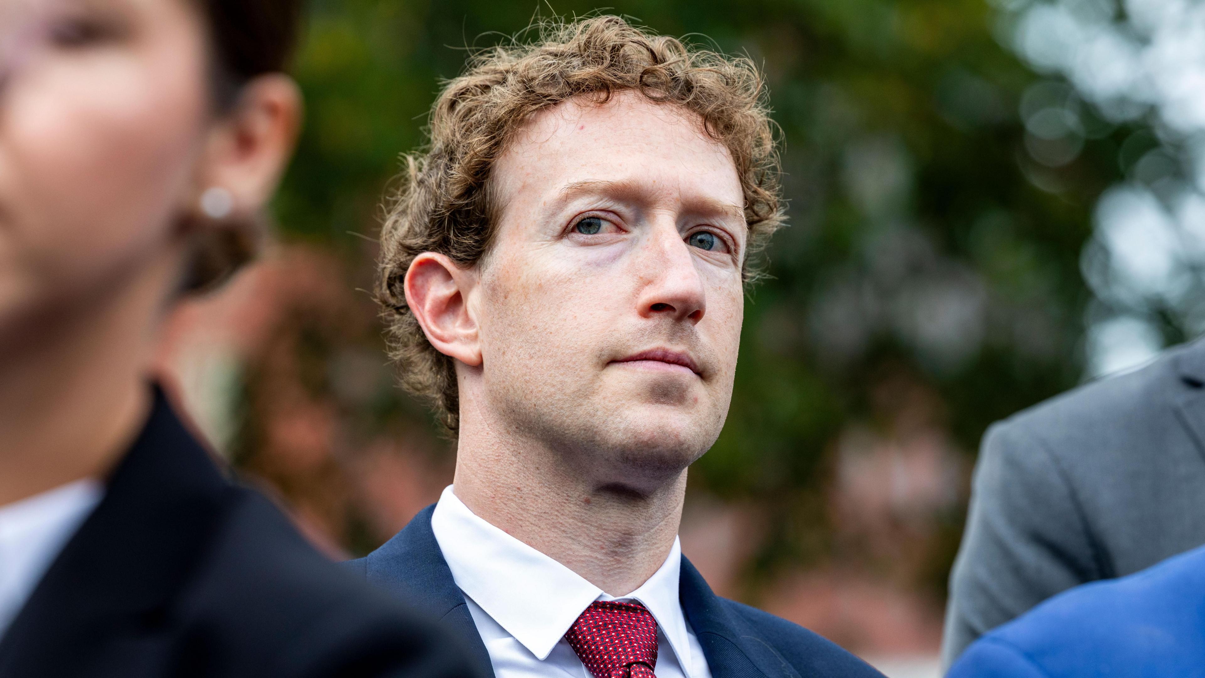 Meta CEO Mark Zuckerberg outlined by security guard