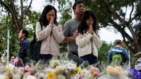 Tragedy in Hong Kong: Fire Death Toll Climbs to 146 as Community Unites in Mourning