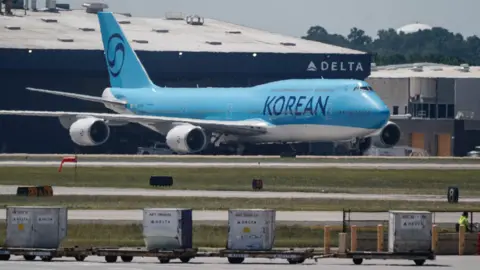 South Korean Workers Return Home After Controversial US Raid