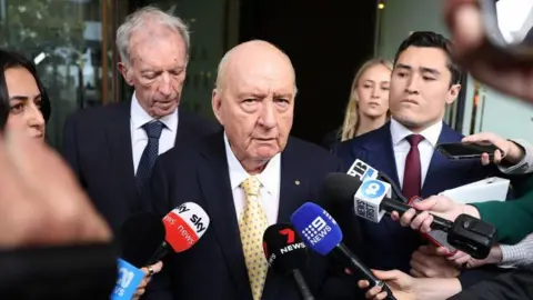 Charges Against Veteran Aussie Radio Host Alan Jones Reduced