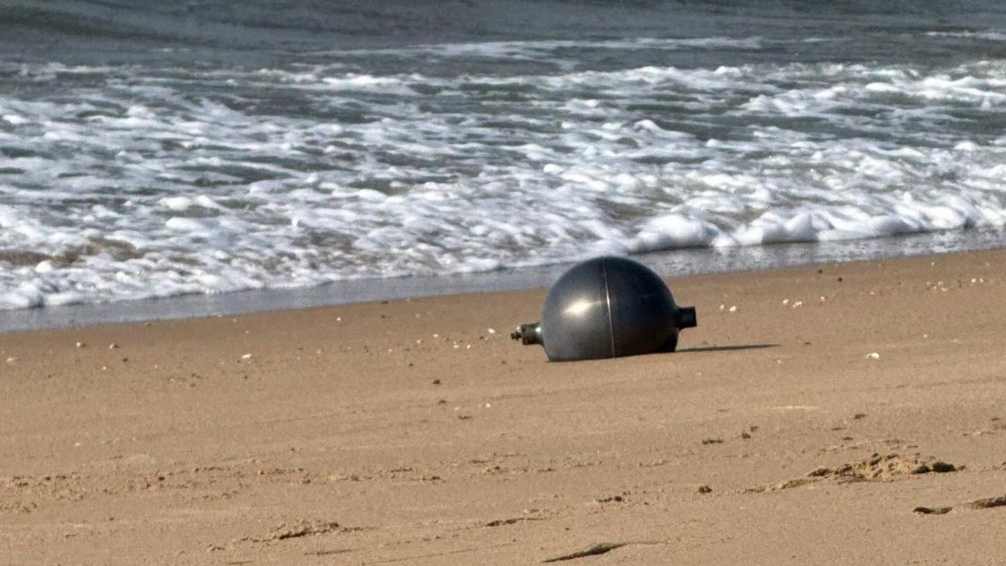 Mystery Silver Spheres Surfed to Australian Beach